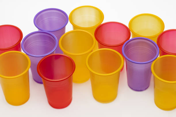 Set of colorful disposable cups for drinks, studio shot. Plastic recycling.