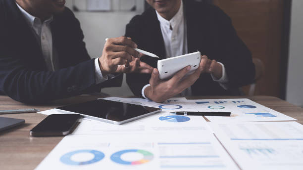 istock Business team hands at working with financial plan, meeting, discussion, brainstrom with tablet on office desk, Meeting concept 1427852959