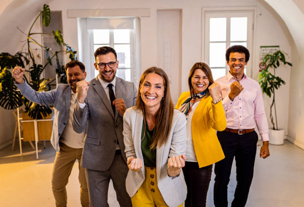 istock Group of business people standing in office. 1427861182
