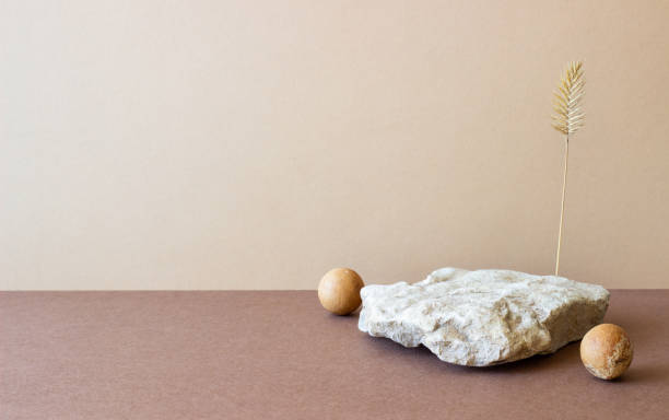 istock A stone podium on a beige background. Presentation of cosmetics. Mockup. Copy space. 1427865705