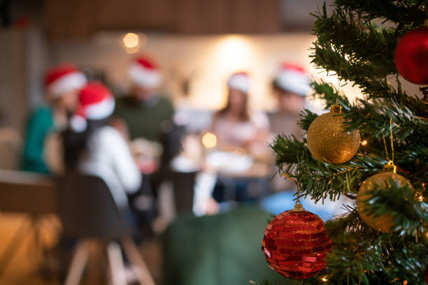 istock Close-up on Christmas decorations while a loving family celebrates 1427871544