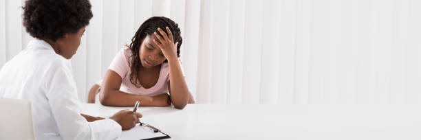 istock Female Doctor Comforting Depressed Patient 1427872141