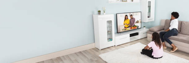 istock Mother And Daughter Watching Television 1427872154