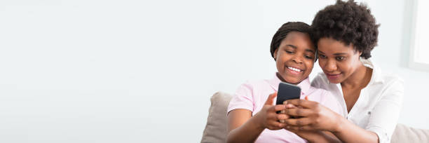 istock Mother And Daughter Looking At Smart Phone 1427872164