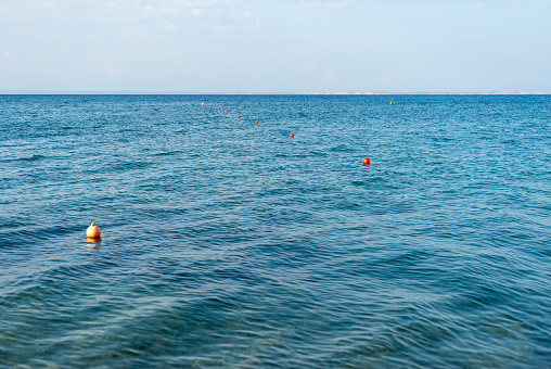 Yellow and red buoys in the sea