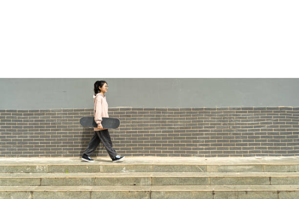 istock Skateboarding girl 1427877263