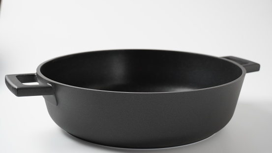 Black pot on a white background. Utensils for cooking