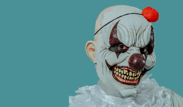 istock creepy evil clown smiles menacingly 1427895002