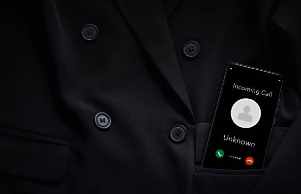 istock closeup smart phone screen with incoming call by unknown from black suit pocket 1427906480