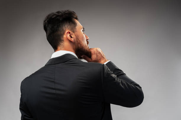 istock Studuo shot of thinking businessman standing over gray background 1427910091