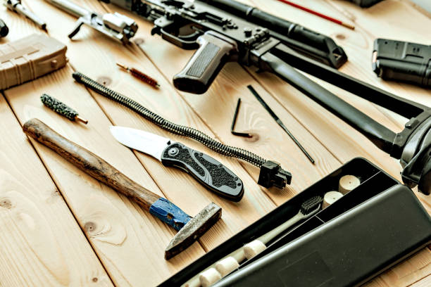istock Disassembled rifle with cleaning tools on table of weapons workshop 1427910301