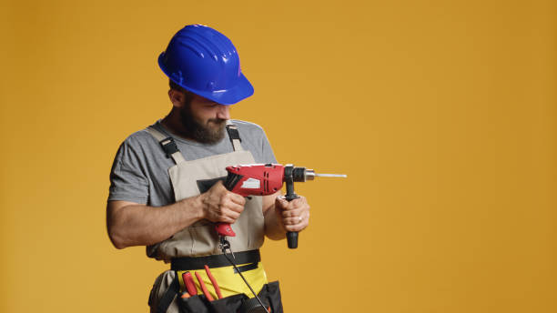 istock Repairman contractor drilling nails with electric power drill 1427912835