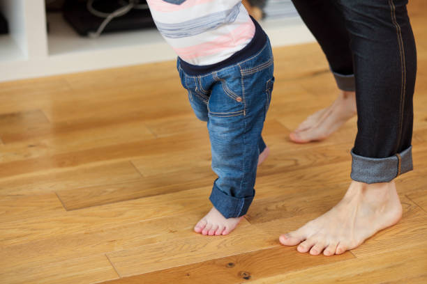 istock Mother teaching her boy to walk 1427913531