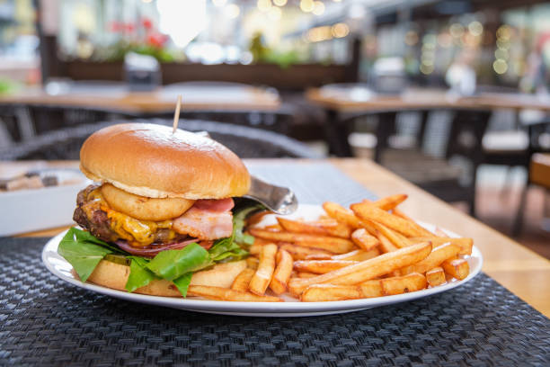 istock Burger with beef, egg and bacon served in a restaurant. Delicious gourmet on a table in a cafe. 1427916249