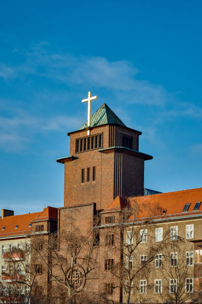 Location: Dänenstrasse – Names: Augustine, Heilige Familie - Architectural specs: monument protection, pyramidal roof