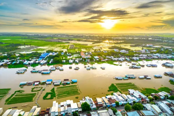 Photo of Floating village along Hau river over Vietnam border area, aerial view