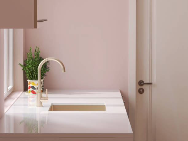 minimale und niedliche rosa küchentheke mit weiß laminierter kunststoffplatte und spüle mit sonnenlicht von fenster an wand - domestic kitchen kitchen sink contemporary counter top stock-fotos und bilder