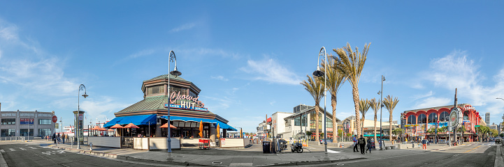 San Francisco, USA - June 7, 2022:  people enjoy eating and looking at fishermans wharf in San Francisco on a sunny afternoon.