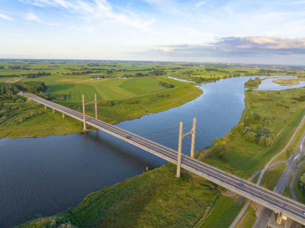 istock Suspension bridge over the river IJssel 1427925459
