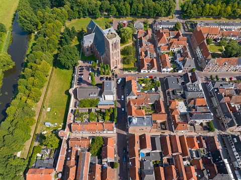 Elburg ancient walled town seen from above during a beautiful summer day in Gelderland, Netherlands. Elburg used to be a fishing town, but now is more focussed on tourism for its location close to the Veluwemeer and Veluwe as popular tourist destinations.