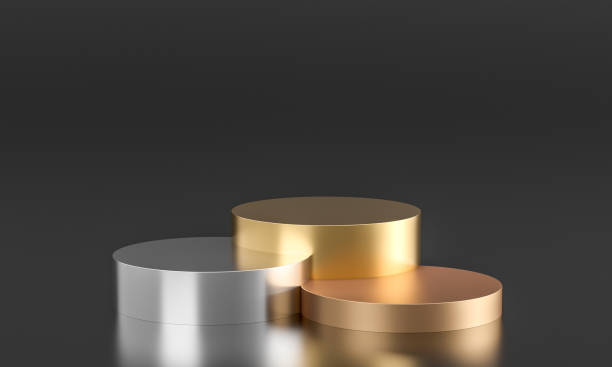istock metallic podiums in gold, bronze, silver on a black background. 1427929755