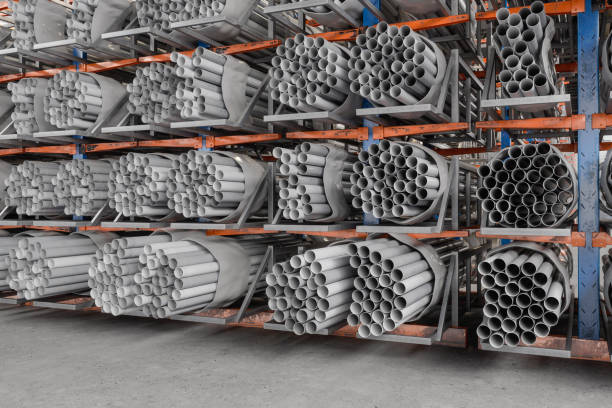 Warehouse Interior With PVC Pipes Stacked Warehouse Interior With PVC Pipes Stacked pvc conduit stock pictures, royalty-free photos & images