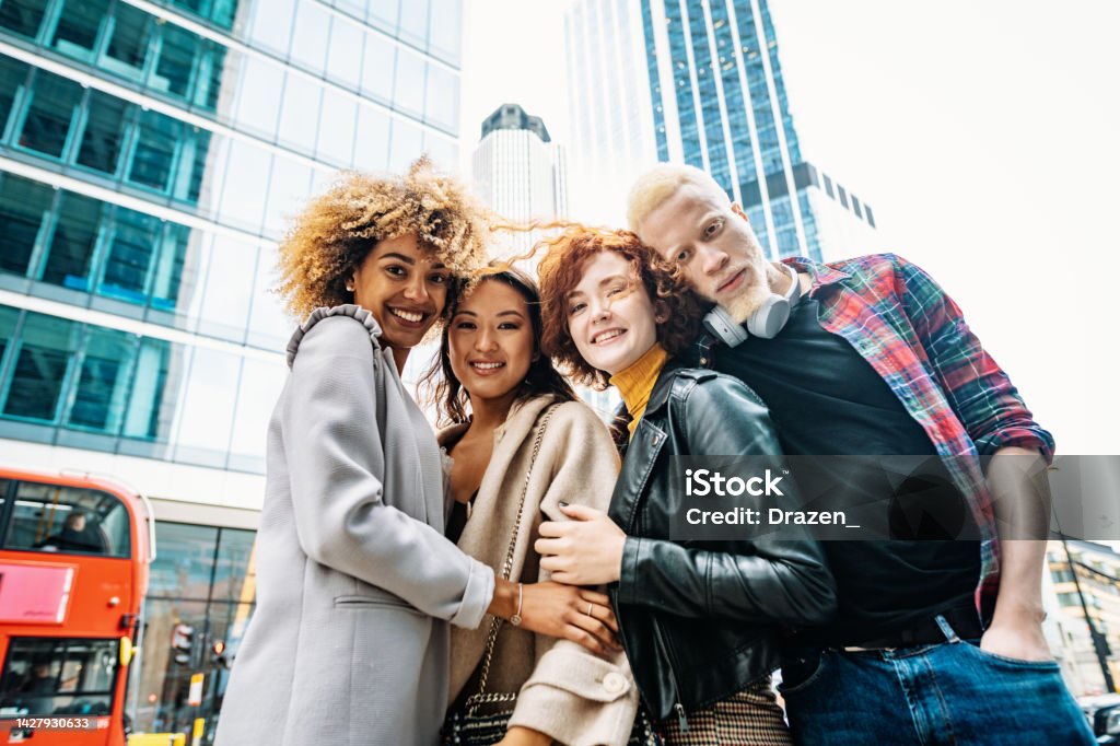 Group of diverse multi ethnic friends in the city taking selfie Group of diverse multi ethnic friends in the city of London 20-24 Years Stock Photo