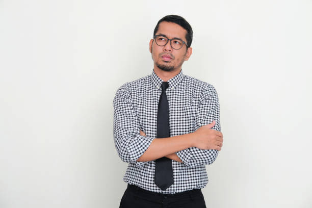 istock Asian businessman thinking about something with serious expression 1427935160