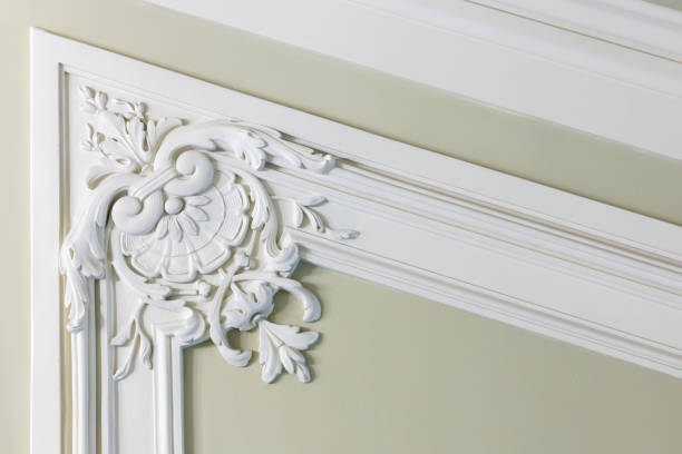 istock Light green wall with classic stucco decoration, abstract 1427936480