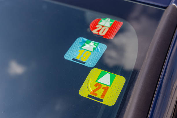 Road Tax Stickers Three Swiss Road Tax Stickers Vignette at Car Windshield vignette stock pictures, royalty-free photos & images