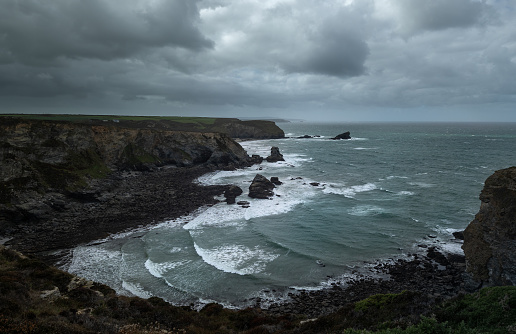 A wider panoramic of a moody and atmospheric coastline.