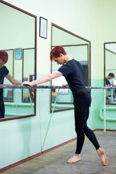 istock Young male dancer practicing new moves in dancing studio 1427948291