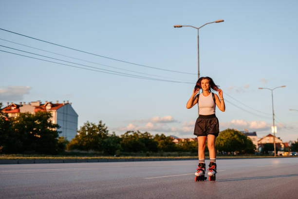 istock Young Woman Roller Skating In A Downtown District 1427948959