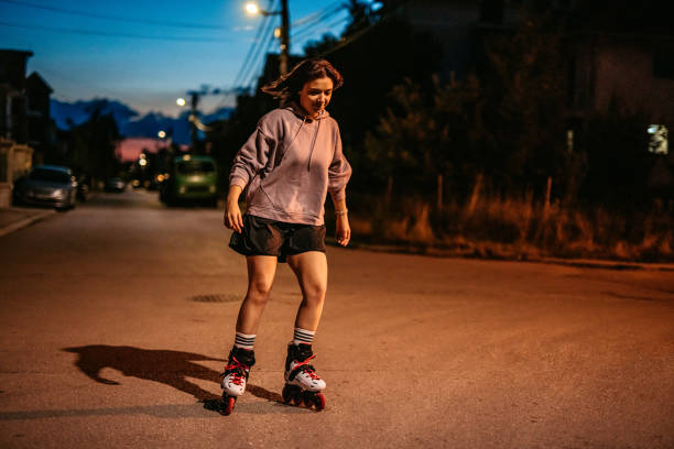 istock Young Woman Roller Skating In A Downtown District At Night 1427949842
