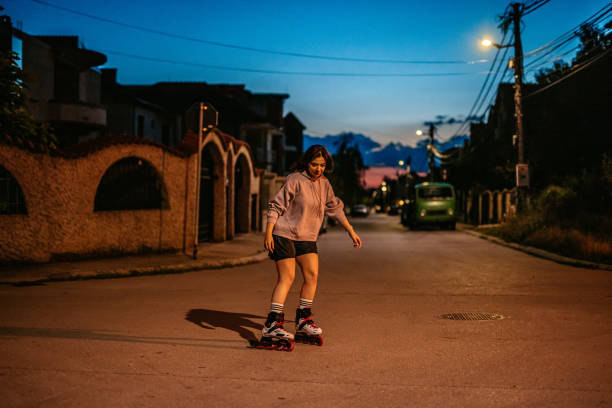 istock Young Woman Roller Skating In A Downtown District At Night 1427949857