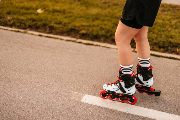 istock Young Woman Roller Skating Down The Street 1427950828