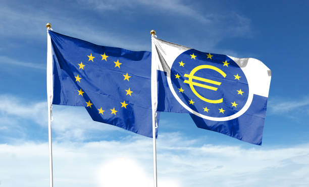 istock Twin flags EU and ECB, waving flags on textured background 1427956355