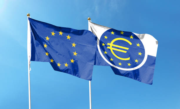 istock Twin flags EU and ECB, waving flags on textured background 1427956371