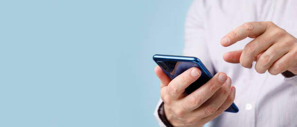 istock Male hands typing on smartphone 1427957026