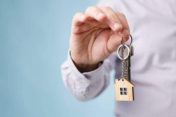 House key in hand stock photo