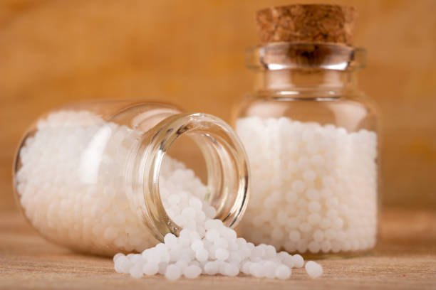 istock Homeopathy globules in glas bottles on a table 1427958685