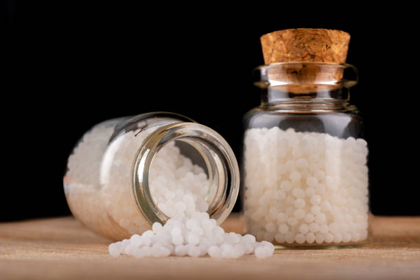 istock Homeopathy globules in glas bottles on a table 1427958857