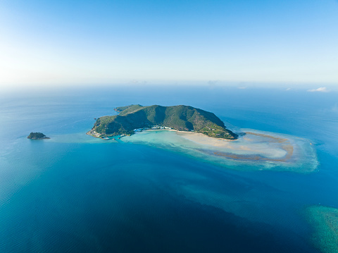 Stunning aerial drone view of Hayman Island, the most northerly of the Whitsunday Islands in Queensland, Australia, near the Great Barrier Reef. Popular tourist destination with a resort hotel.