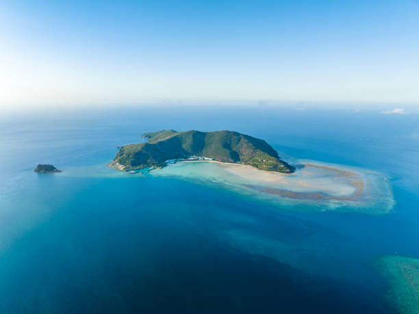 Stunning aerial drone view of Hayman Island, the most northerly of the Whitsunday Islands in Queensland, Australia, near the Great Barrier Reef. Popular tourist destination with a resort hotel. stock photo