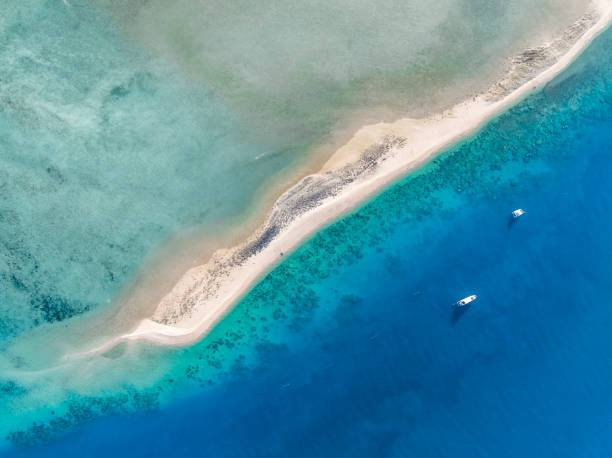 High angle aerial drone view of Langford Island's sandspit or sandbar, a small islet near Hayman Island in the Whitsunday Islands group near the Great Barrier Reef in Queensland, Australia. stock photo