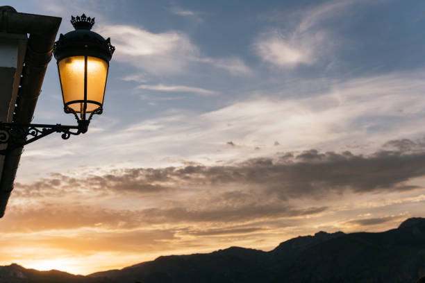istock Candlelight at dusk on a cloudy day with high mountains all around. 1427960312