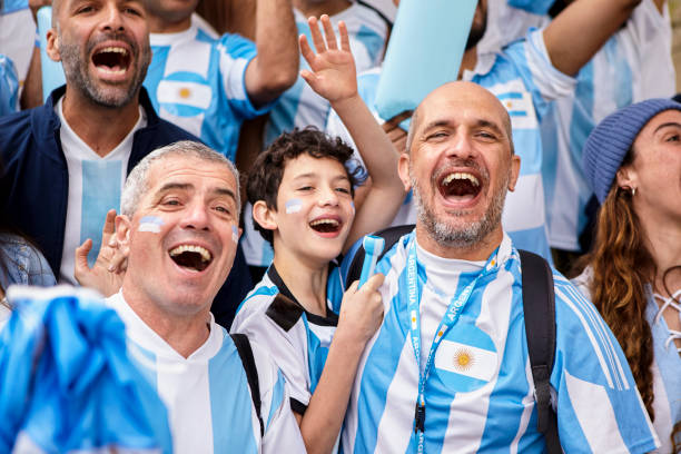 istock Argentinian father and son celebrating in the crowd while watching soccer match 1427961224