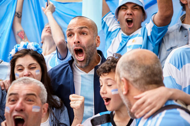 istock Argentinian adult man screaming goal while watching soccer match 1427961266