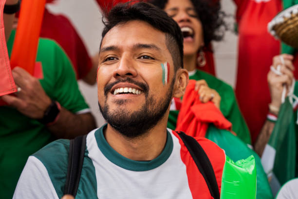 istock Mexican man celebrating during football match 1427961318