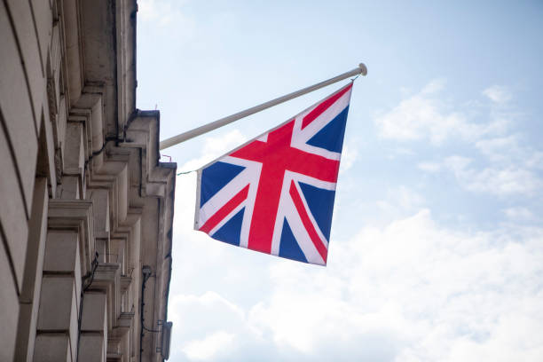 istock Union Jack outside an official building in London 1427963055